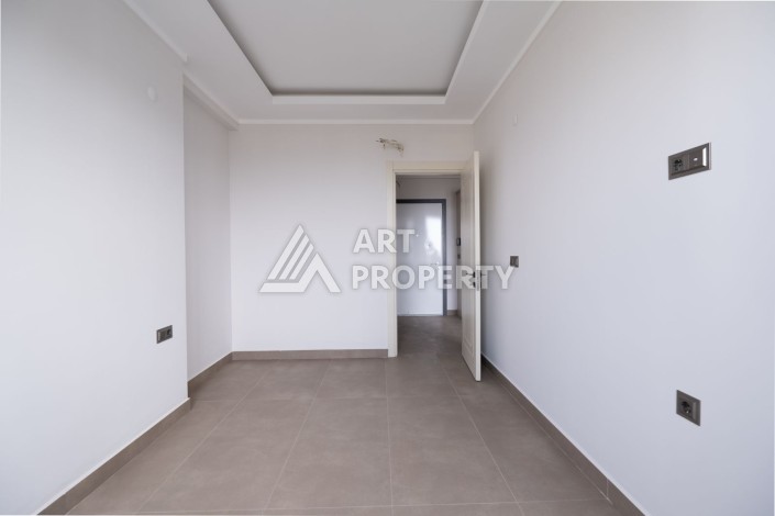 Квартира 1+1 в новом ЖК, 55 кв.м. Махмутлар, Алания - Ракурс 7