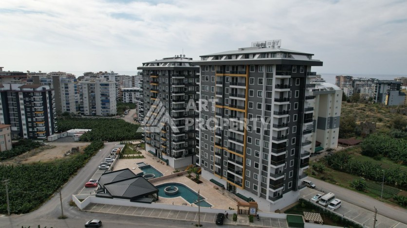 Квартира 1+1 в новом ЖК, 55 кв.м. Махмутлар, Алания - Ракурс 8