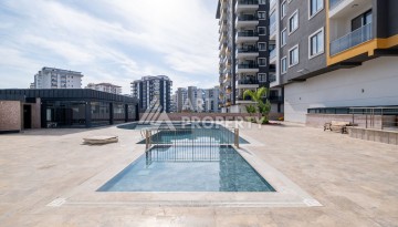 Квартира 1+1 в новом ЖК, 55 кв.м. Махмутлар, Алания - Ракурс 12