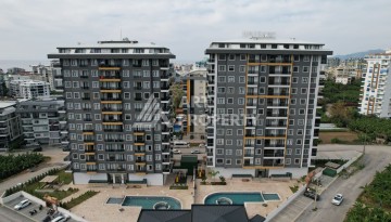 Квартира 1+1 в новом ЖК, 55 кв.м. Махмутлар, Алания - Ракурс 25