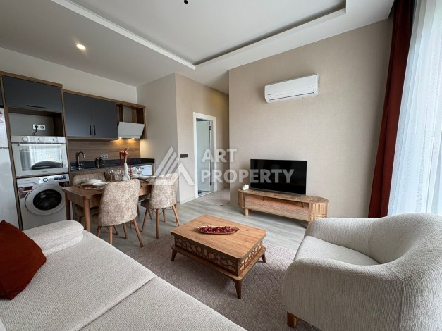 Квартира 1+1 в центре Махмутлара, 50 кв.м. - Ракурс 1