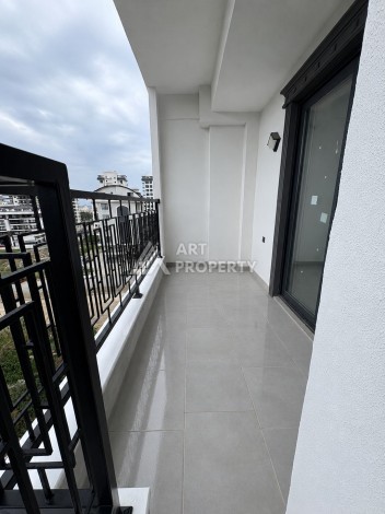 Квартира 1+1 в центре Махмутлара, 50 кв.м. - Ракурс 10
