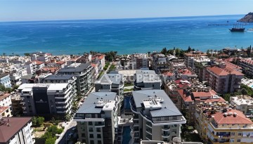 Дуплекс 2+1 с видом на море в центре Алании в легендарном проекте города - Ракурс 1