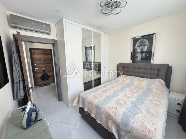 Квартира 1+1 в престижном ЖК Махмутлара, 55 кв.м. - Ракурс 2