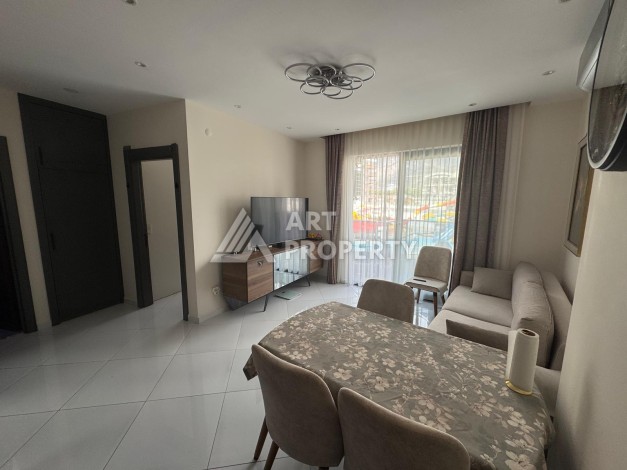 Квартира 1+1 в престижном ЖК Махмутлара, 55 кв.м. - Ракурс 9