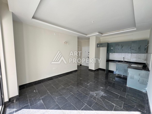 Квартира 1+1 в центре Махмутлара, 55 кв.м. Современный ЖК - Ракурс 3