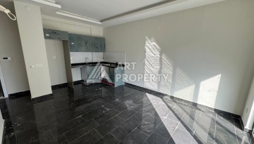 Квартира 1+1 в центре Махмутлара, 55 кв.м. Современный ЖК - Ракурс 9