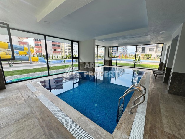 Квартира 1+1 в центре Махмутлара, 55 кв.м. Современный ЖК - Ракурс 20