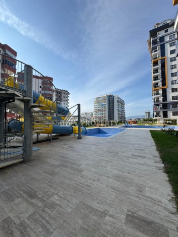 Квартира 1+1 в центре Махмутлара, 55 кв.м. Современный ЖК - Ракурс 29