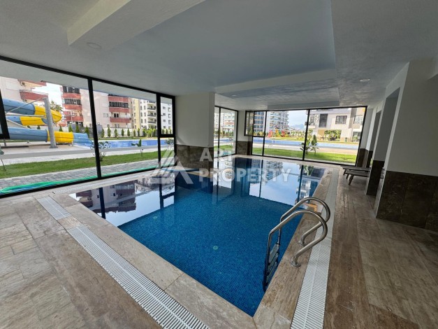 Квартира 1+1 в центре Махмутлара, 55 кв.м. Современный ЖК - Ракурс 32