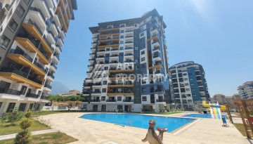 Квартира 1+1 в центре Махмутлара, 55 кв.м. Современный ЖК - Ракурс 37