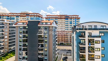 Квартира 1+1 с видом на море в Махмутларе, 65 кв.м. - Ракурс 41