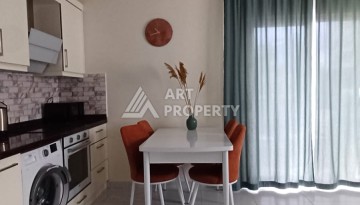 Квартира 1+1 с видом на бассейн в Махмутларе, 50 кв.м. - Ракурс 1