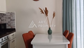 Квартира 1+1 с видом на бассейн в Махмутларе, 50 кв.м. - Ракурс 2