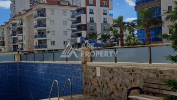 Квартира 1+1 с видом на бассейн в Махмутларе, 50 кв.м. - Ракурс 22