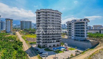 Недорогая квартира 1+1 в новой резиденции, 54 кв.м. в Махмутларе - Ракурс 1