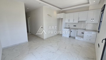 Недорогая квартира 1+1 в новой резиденции, 54 кв.м. в Махмутларе - Ракурс 7