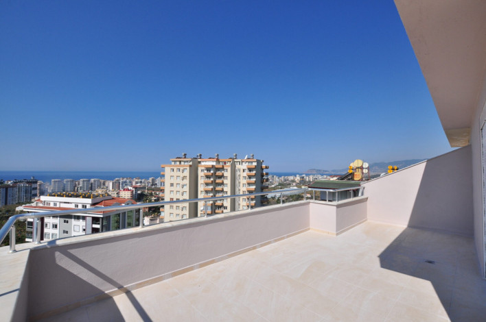 Четырехкомнатная квартира-дуплекс на высоком этаже с частичным видом на море в районе Махмутлар, 220 м2 - Ракурс 12