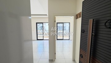 Квартира 1+1 с большим балконом Махмутларе, 55 кв.м. - Ракурс 2