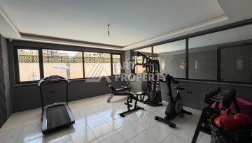 Квартира 1+1 с большим балконом Махмутларе, 55 кв.м. - Ракурс 11