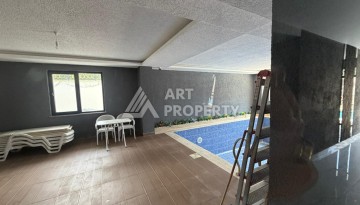 Квартира 1+1 с большим балконом Махмутларе, 55 кв.м. - Ракурс 13