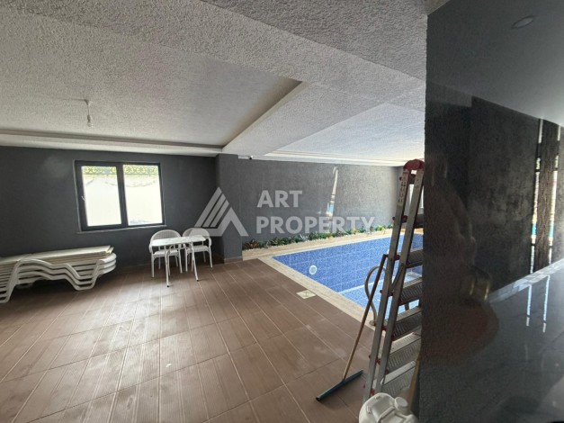 Квартира 1+1 с большим балконом Махмутларе, 55 кв.м. - Ракурс 12