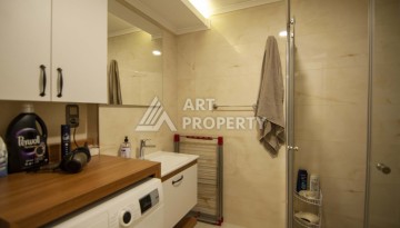 Квартира 1+1 с видом на море в Махмутларе, 60 кв.м. - Ракурс 12