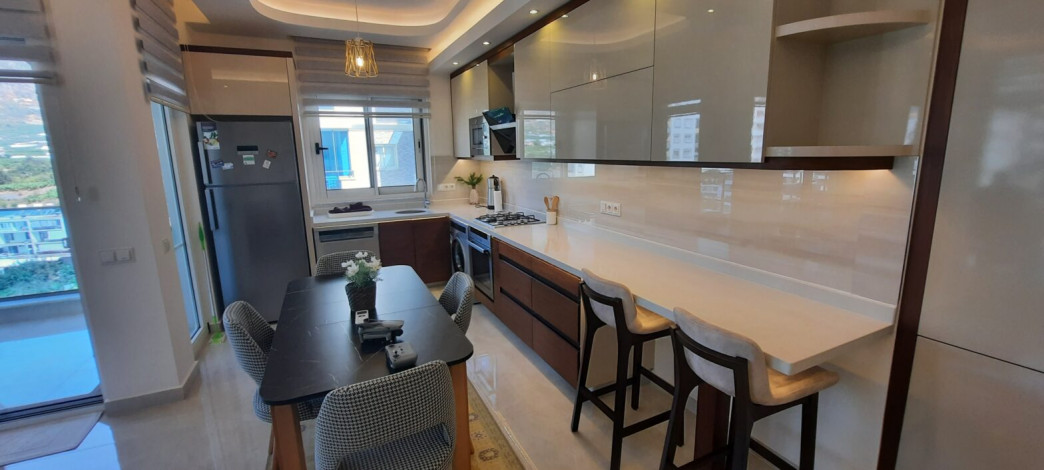 Трехкомнатная квартира в одном из лучших комплексов района Махмтулар,  130 м2 - Ракурс 13