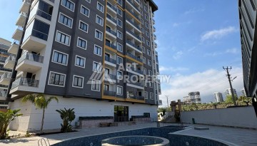 Квартира 2+1 в Махмутларе, 90 кв.м. Современный ЖК - Ракурс 1