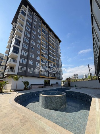 Квартира 2+1 в Махмутларе, 90 кв.м. Современный ЖК - Ракурс 0