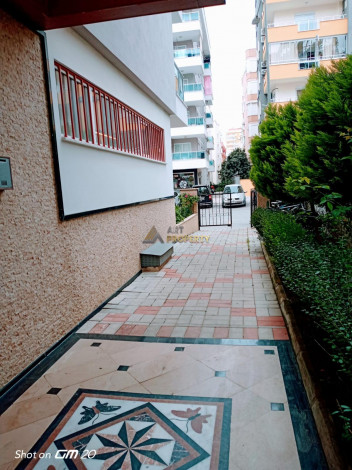 Квартира 1+1 в Махмутларе с отличной локацией, 65 м2 - Ракурс 12