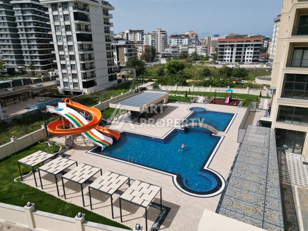 Квартира 1+1 в самом центре Махмутлара, 56 кв.м. - Ракурс 11