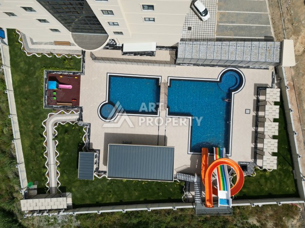 Квартира 1+1 в самом центре Махмутлара, 56 кв.м. - Ракурс 12