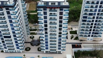 Квартира 1+1 в элитном ЖК, 50 кв.м. Махмутлар, Алания - Ракурс 2