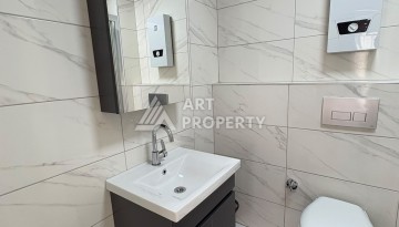Квартира 1+1 в 5 минутах от субботнего рынка, 47 кв.м. в Махмутларе - Ракурс 11