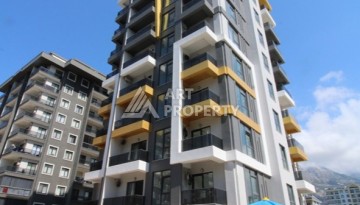 Квартира 1+1 в центре Махмутлара, 55 кв.м. Новый ЖК недалеко от Akdeniz Park - Ракурс 1