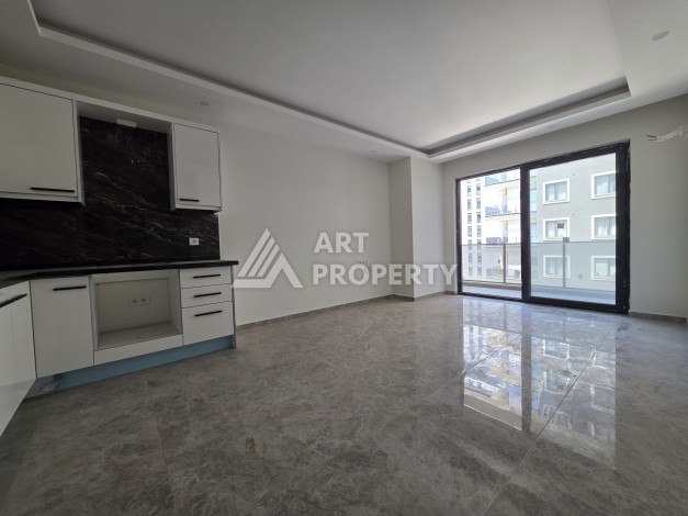 Квартира 1+1 в центре Махмутлара, 55 кв.м. Новый ЖК недалеко от Akdeniz Park - Ракурс 1