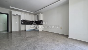 Квартира 1+1 в центре Махмутлара, 55 кв.м. Новый ЖК недалеко от Akdeniz Park - Ракурс 3