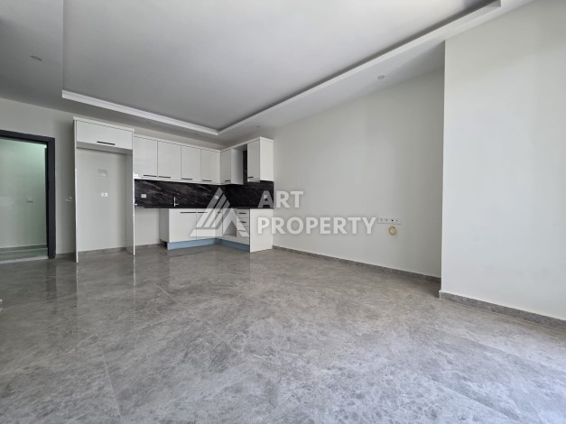 Квартира 1+1 в центре Махмутлара, 55 кв.м. Новый ЖК недалеко от Akdeniz Park - Ракурс 2