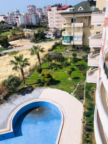 Просторная трехкомнатная квартира с инфраструктурой в зеленом районе Авсаллар, 105 м2 - Ракурс 2