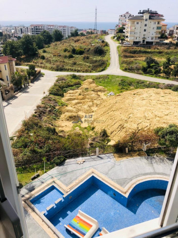 Просторная трехкомнатная квартира с инфраструктурой в зеленом районе Авсаллар, 105 м2 - Ракурс 12