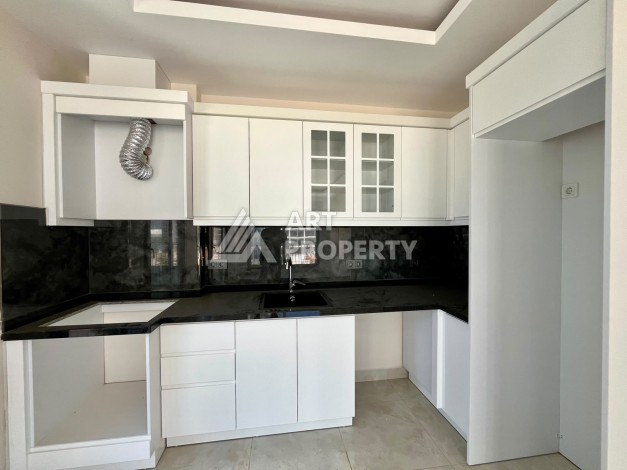 Квартира 1+1 в центре Махмутлара - 55 кв.м. Новый ЖК - Ракурс 3