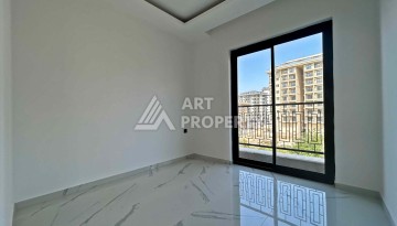 Квартира 1+1 в Махмутларе рядом с субботним рынком, 50 м² - Ракурс 10