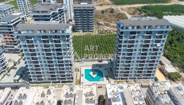 Квартира 1+1 в центре Махмутлара, 60 м². Вид на море - Ракурс 1