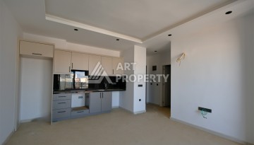 Квартира 1+1 в центре Махмутлара, 60 м². Вид на море - Ракурс 3