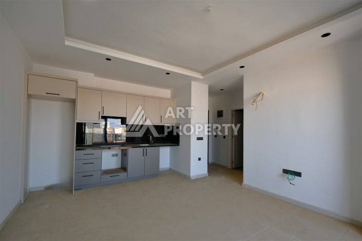 Квартира 1+1 в центре Махмутлара, 60 м². Вид на море - Ракурс 2