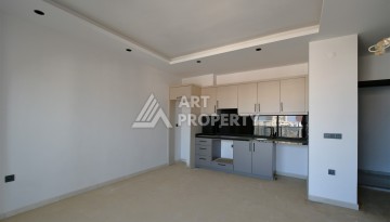 Квартира 1+1 в центре Махмутлара, 60 м². Вид на море - Ракурс 6