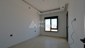 Квартира 1+1 в центре Махмутлара, 60 м². Вид на море - Ракурс 10