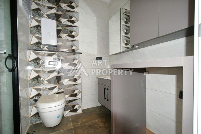 Квартира 1+1 в центре Махмутлара, 60 м². Вид на море - Ракурс 13
