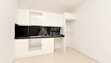 Квартира 1+1 в Махмутларе в новой резиденции, 50 м² - Ракурс 3
